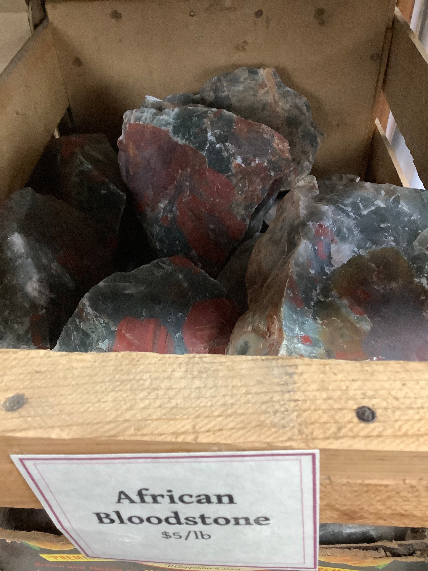 African bloodstone rough by pound in crate