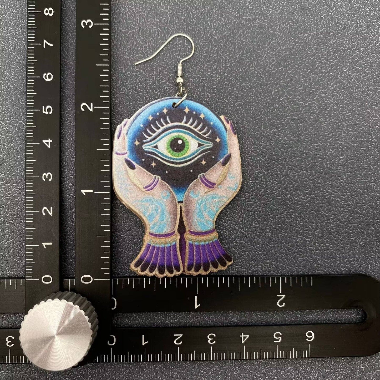 Holding Devil's Eye Crystal Ball Acrylic Dangle Earrings